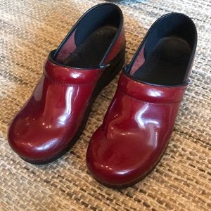 Red Patent leather Dansko clogs.